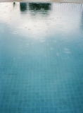 Rain drops on a swimming pool.